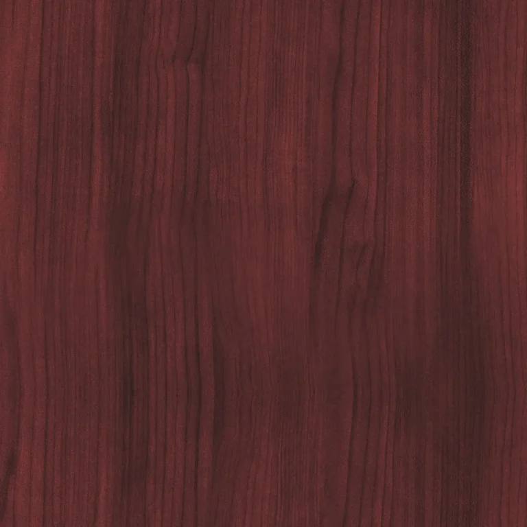 Mahogany wood samples on a workbench with a loupe and caliper in natural light