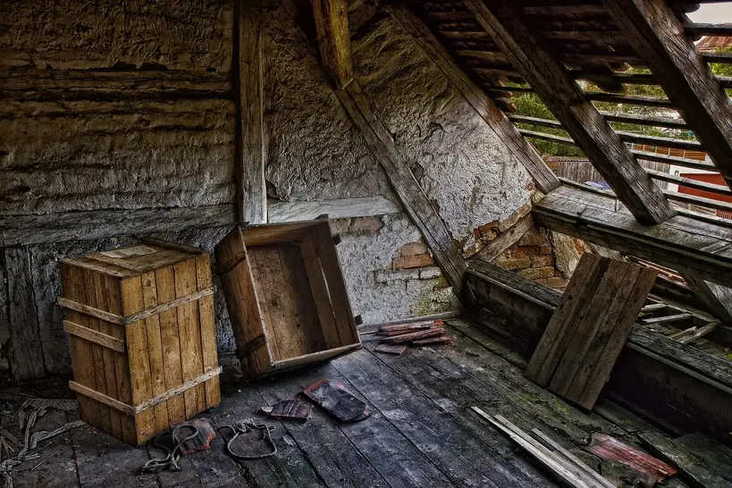 Carpenter comparing lumber boards with a tape measure and calculator beside a sizing chart