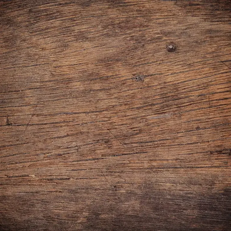 Stacked oak lumber samples beside woodworking tools in natural light