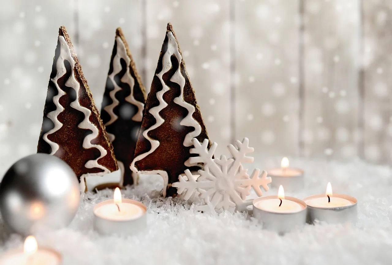 Finished wooden snowflake pattern on a workbench with ruler, pencil, clamps, and pine boards