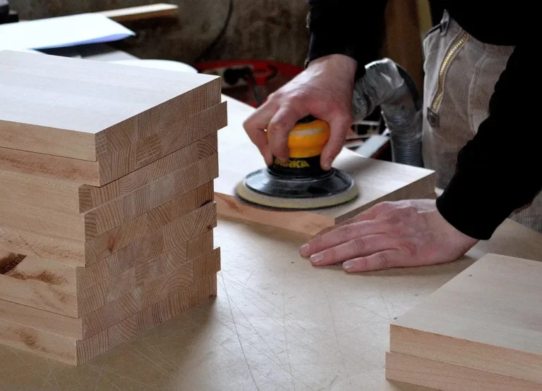 Woodworking project ideas and plans beside boards, clamps, tools, and a partly built shelf in a bright workshop